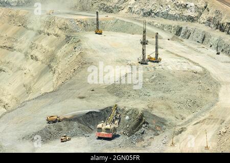 Electric rope shovel blasthole drills  at a copper mine in Chile Stock Photo