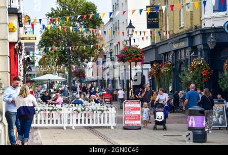 Busy Warwick Street shopping area with restaurants , pubs and cafes in Worthing , West Sussex , England , UK Stock Photo