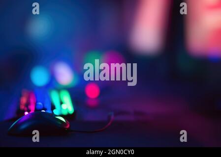 Colorful computer room with selective focus on computer mouse Stock Photo