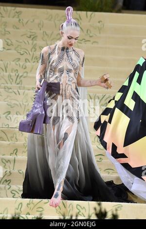 Grimes attends The 2021 Met Gala Celebrating In America: A Lexicon Of Fashion at The Metropolitan Museum of Art on September 13, 2021 in New York City Stock Photo