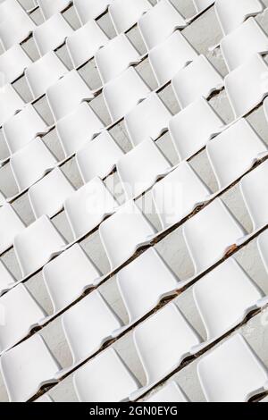 abstract image of arena or stadium white plastic seating. textural plastic seats. abstract white plastic seating in an auditorium for background use. Stock Photo