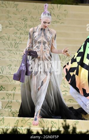 Grimes attends The 2021 Met Gala Celebrating In America: A Lexicon Of Fashion at The Metropolitan Museum of Art on September 13, 2021 in New York City Stock Photo