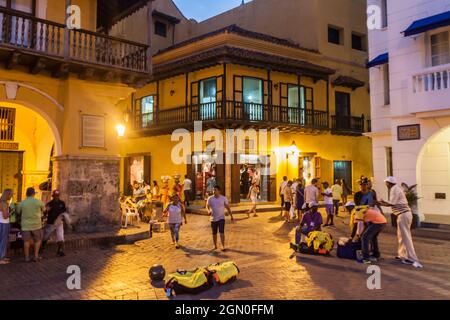 CARTAGENA DE INDIAS, COLOMBIA - AUG 27, 2015: People walk at the Plaza de los Coches in Cartagena during evening. Stock Photo
