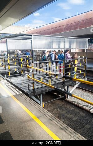 MEDELLIN, COLOMBIA - SEPTEMBER 1: Commuters at San Antonio station of Medellin metro. Stock Photo