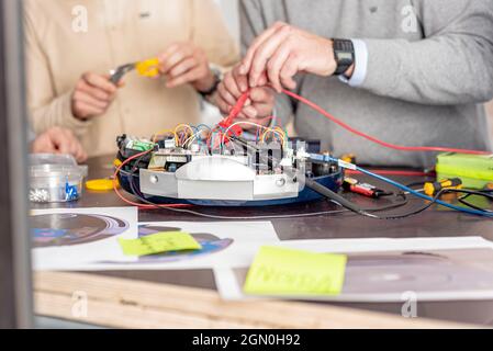 a team of engineers working on a new prototype Stock Photo