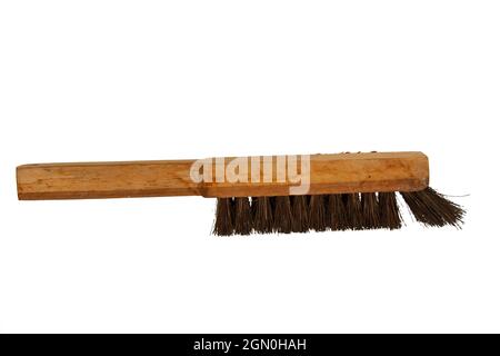 Hand made Brush with wood handle and fibers from palm fiber, isolated on white background with clipping path Stock Photo