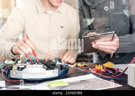 a team of engineers working on a new prototype Stock Photo