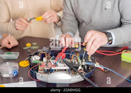 a team of engineers working on a new prototype Stock Photo
