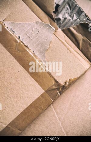 Ripped and damaged pieces of a cardboard box Stock Photo