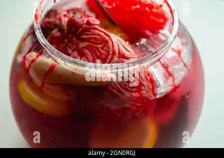 Punch prepared for Halloween party with decorative elements stylized as human organs, scary drink Stock Photo