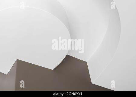 Abstract architectural photo background. Minimal interior fragment with white round details and corners near brown wall Stock Photo