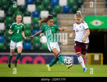 Northern Ireland’s Louise McDaniel (18) (left) in action against Latvia’s Olga Sevcova during the FIFA Women's World Cup qualifying match at Windsor Park, Belfast. Picture date: Tuesday September 21, 2021. Stock Photo