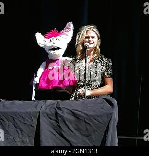 Ventriloquist Darci Lynne Farmer winner of NBCÕs AGT 2017 season performs on stage at the Kansas State Fair with her bunny puppet Petunia. Stock Photo