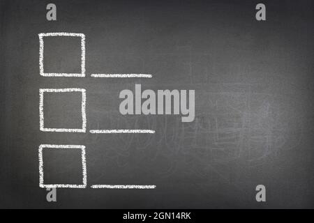 Three Open Checkboxes Three checkboxes drawn on a chalkboard show a decision making need ...