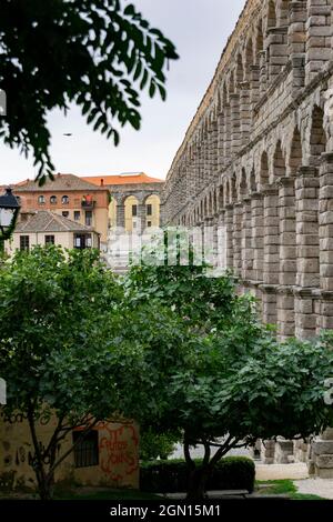 SEGOVIA SPAIN - SEPTEMBER 21, 2021. Aqueduct of Segovia. Ancient Roman aqueduct in the Plaza del Azoguejo and old construction cities in Segovia. Stock Photo