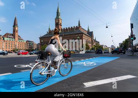 Cyclists on cycle paths, Radhuspladsen, City Hall Square, in downtown Copenhagen, is considered the cycling capital of the world, 45% of residents tra Stock Photo