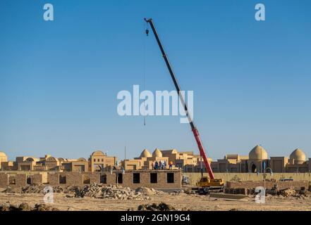 Construction works near Karavan-Saray, a multifunctional tourist complex attraction, in historic city Turkistan, Kazakhstan Stock Photo