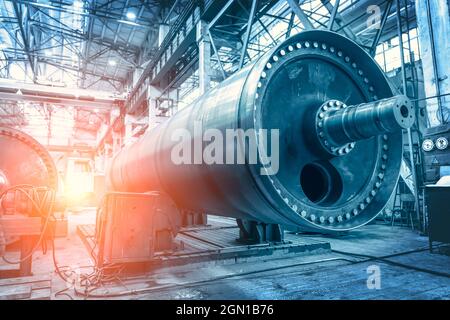 Big steel cylinder tube or pipe as abstract Industrial background. Metalworking factory. Heavy industry concept. Stock Photo
