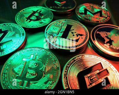 A pile of cryptocurrency coins. A digital asset designed to work as a medium of exchange that uses strong cryptography to secure financial transaction Stock Photo