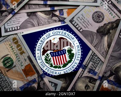 Ukraine. 21st Sep, 2021. In this photo illustration, Federal Reserve emblem seen displayed on a smartphone on the background of US dollars banknotes. Credit: SOPA Images Limited/Alamy Live News Stock Photo