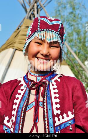 Young people in traditional costumes for tourist presentations. Shigansk is a settlement on the lower reaches of the Lena, where it crosses the Arctic Stock Photo