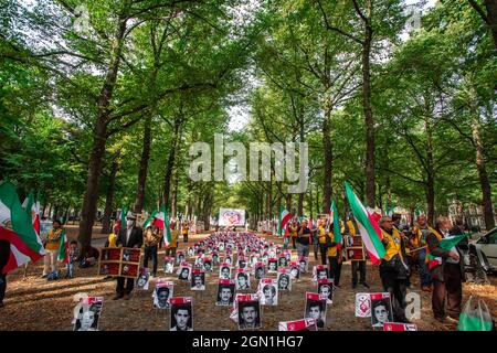 Lange Voorhout, The Hague, The Netherlands. Tuesday 21st September, 2021. Ebrahim Raisi, a hard-line cleric close to the Supreme Leader Ayatollah Ali Khamenei, was elected Iran's president in June 2021. Raisi, was previously head of the country's judiciary, and has ultra-conservative political views. Many Iranians and human rights activists and organisations have pointed out his alleged role in the mass executions of political prisoners in the 1980s. The tribunals 're-tried' thousands of prisoners already serving jail sentences for their political activities and most were members of the leftis Stock Photo