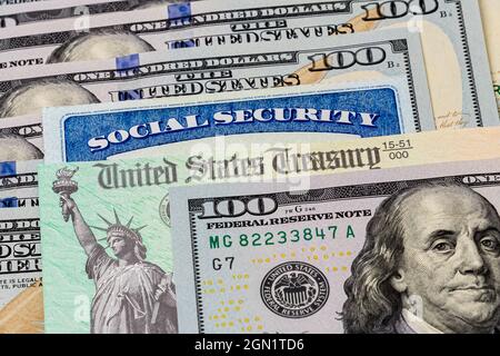 Social Security card, treasury check and 100 dollar bills. Concept of social security benefits payment, retirement and federal government benefits Stock Photo