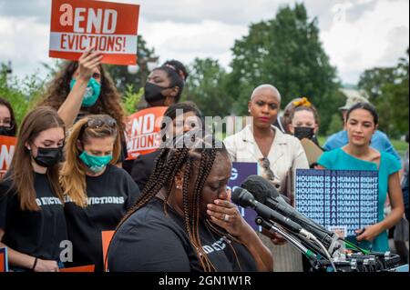 Washington DC, US, 21/09/2021, Vivian Smith, of Miami, Florida, tears up while talking about her experiences of being evicted with her two children, during a press conference about the Keeping Renters Safe Act of 2021, at the US Capitol in Washington, DC, Tuesday, September 21, 2021. Vivian is a single mother of two children who was evicted last year during the pandemic after her landlord filed an eviction case against her after getting behind on her rent, and she has been forced to make choices between buying food, health care and rent to survive. Act Credit: Rod Lamkey/CNP Stock Photo