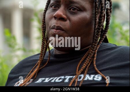 Washington DC, US, 21/09/2021, Vivian Smith, of Miami, Florida, waits to speak at a press conference about the Keeping Renters Safe Act of 2021, at the US Capitol in Washington, DC, Tuesday, September 21, 2021. Vivian is a single mother of two children who was evicted last year during the pandemic after her landlord filed an eviction case against her after getting behind on her rent, and she has been forced to make choices between buying food, health care and rent to survive. Act Credit: Rod Lamkey/CNP Stock Photo