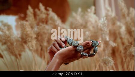 African hands which are holding a traditional necklace Stock Photo