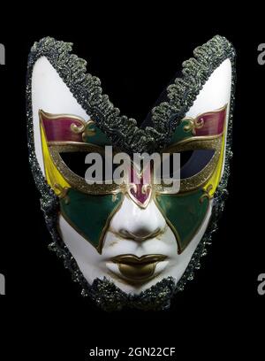 Mardi Grass masquerade ball mask in traditional colors purple green and white with green lace trim Stock Photo