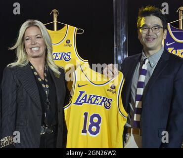 Los Angeles Lakers CEO Jeanie Buss holds a new Lakers jersey with Bibigo Head of Global Business Planning Sun-Ho Lee during the team's kick-off event to announce a new global marketing partnership with Bibigo, a popular South Korean food company at the UCLA Health Training Center in El Segundo, California on Monday, September 20, 2021. The Lakers' $100 million partnership with Bibigo is now the largest jersey patch deal in the NBA. It's also the league's first jersey patch deal with a company outside of the United States and LA's first international partnership in franchise history. Photo by J Stock Photo