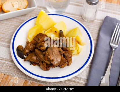 Fried rabbit liver served with boiled potato Stock Photo
