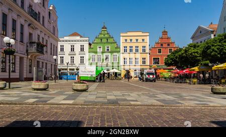 GUESTROW, MECKLENBURG-WESTERN POMERANIA, GERMANY - market place of Guestrow with town hall, restaurant and other historic buildings Stock Photo