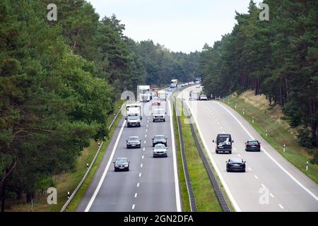 21 September 2021, Brandenburg, Wandlitz/Ot Prenden: Trucks and cars travel near the Lanke exit on the A10 motorway in both directions. Photo: Soeren Stache/dpa-Zentralbild/dpa Stock Photo