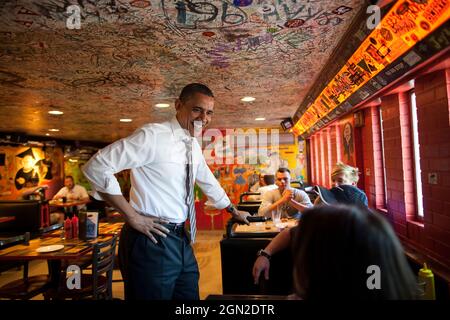 President Barack Obama greets patrons at the Sink Restaurant & Bar in Boulder, Colo., April 24, 2012. (Official White House Photo by Pete Souza) This official White House photograph is being made available only for publication by news organizations and/or for personal use printing by the subject(s) of the photograph. The photograph may not be manipulated in any way and may not be used in commercial or political materials, advertisements, emails, products, promotions that in any way suggests approval or endorsement of the President, the First Family, or the White House. Stock Photo