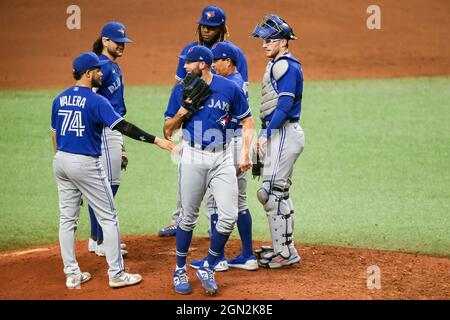 St. Petersburg, FL. USA;  Toronto Blue Jays manager Charlie Montoyo (25) makes a pitching change after  starting pitcher Alek Manoah (6) pitched six i Stock Photo