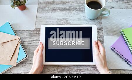 Subscribe button on device screen. Internet and digital marketing concept Stock Photo