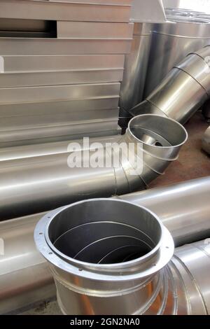 Round and angular galvanized pipes Stock Photo