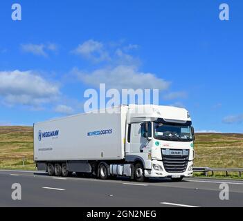 HGV. Hegelmann Group. #EXPRESSLOGISTICS. M6 Motorway, Southbound. Shap, Cumbria, England, United Kingdom, Europe. Stock Photo