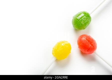 Three delicious lollipops isolated on white. Stock Photo