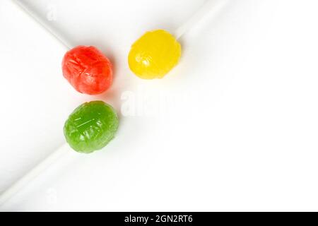 Three delicious lollipops isolated on white. Stock Photo