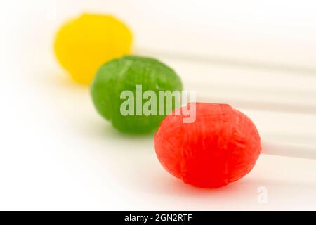 Three delicious lollipops isolated on white. Stock Photo