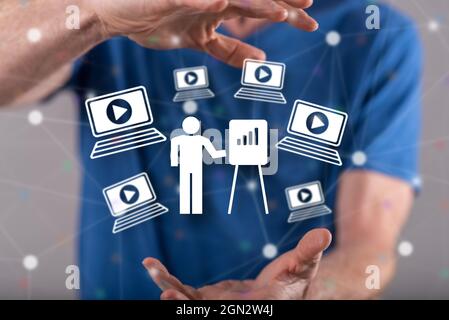 Webinar concept between hands of a man in background Stock Photo Alamy