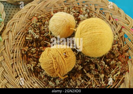 Basket of Yellow Peruvian Alpaca Wool Yarn Balls Natural Dyed from Local Plants, the Andes Village of Chinchero, Cuzco Region, Peru Stock Photo