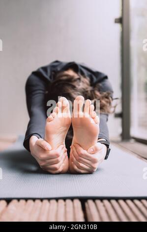 Young woman doing yoga Stock Photo