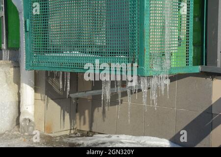 Industrial air conditioner compressor in ice. Stock Photo