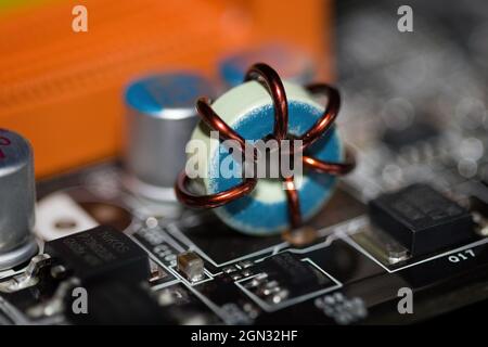 Close up of inductor copper coil on circuit board Stock Photo - Alamy