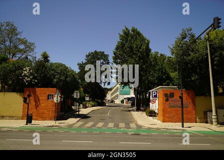 LISBON, PORTUGAL - Jul 13, 2021: The entrance to the Hospital Pulido Valente in Lumiar with an empty street on a sunny day Stock Photo