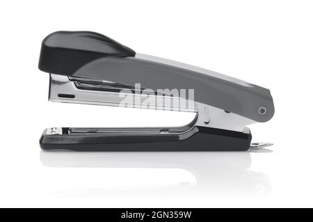 Side view of grey metal office stapler isolated on white Stock Photo